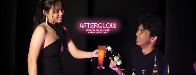 Rooftop DJ night with warm amber lighting and skyline view at F1 Hotel Manila