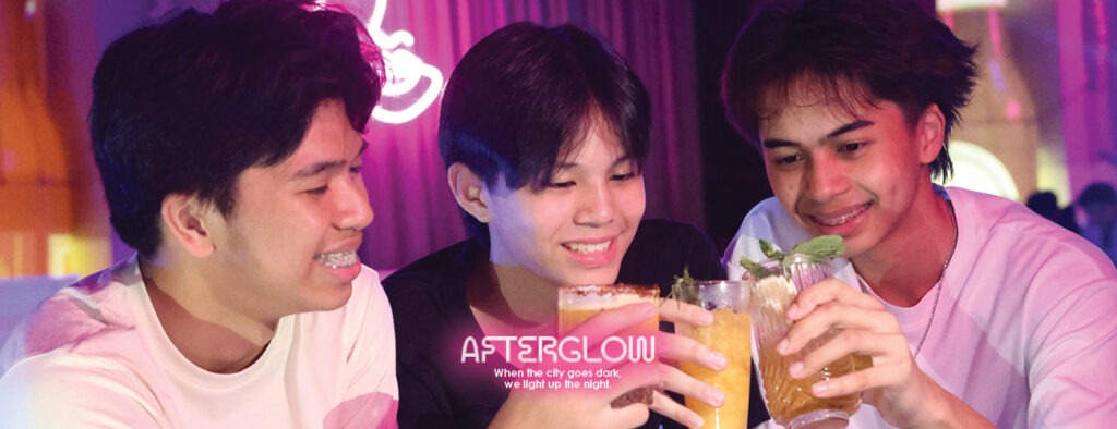 Rooftop DJ night with warm amber lighting and skyline view at F1 Hotel Manila